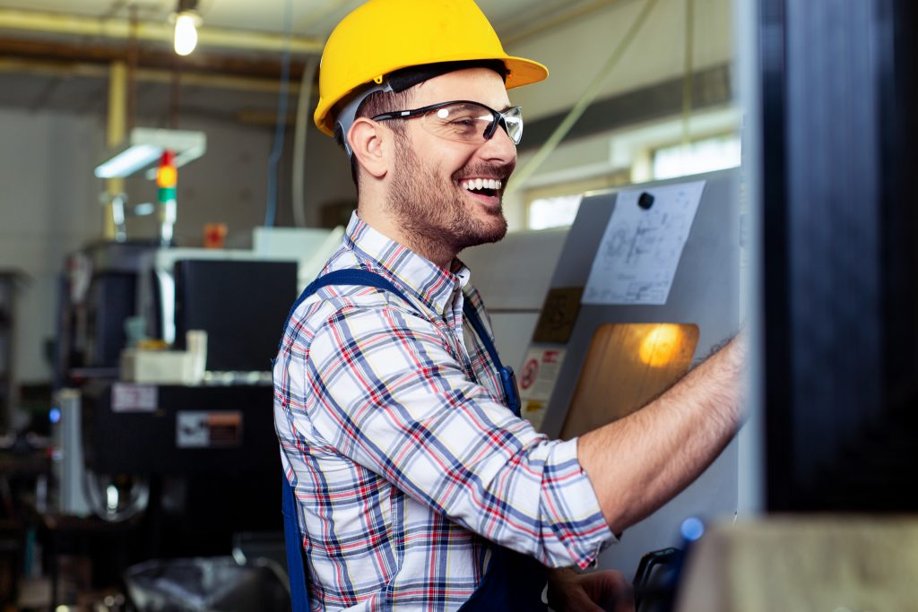 industrial factory employee smiling while working